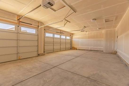Vaulted ceiling drywall hung and taped with recessed light cutouts, representative project photo